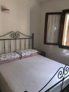 Postel nebo postele na pokoji v ubytování Torre dei Corsari mit Aussicht auf Meer und Dune