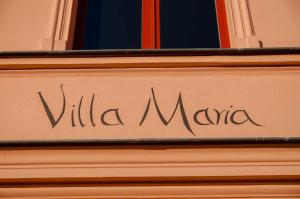 a sign on the side of a building at Villa Maria Wohnung 04 in Ostseebad Koserow