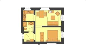 a floor plan of a house with furniture at Villa Maria Wohnung 04 in Ostseebad Koserow