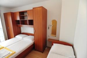 Postel nebo postele na pokoji v ubytování Apartments Knežević