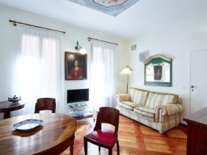 a living room with a couch and a table at Palazzo Morosini Brandolin Dimora Romantica in Venice