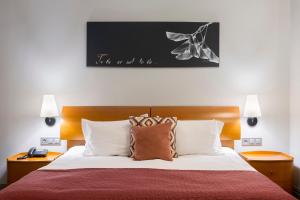מיטה או מיטות בחדר ב-Villa Four Rooms
