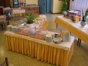 a buffet table with food on top of it at Residence Miralago Rooms & Apartments in Manerba del Garda