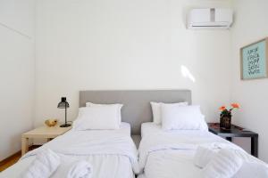 Posteľ alebo postele v izbe v ubytovaní Athens Heartbeat