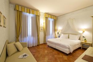 En eller flere senger på et rom på Hotel Davanzati