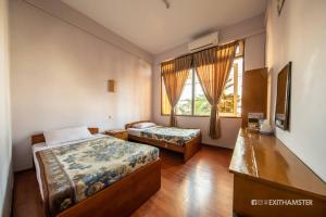 Ένα ή περισσότερα κρεβάτια σε δωμάτιο στο Gypsy Inn