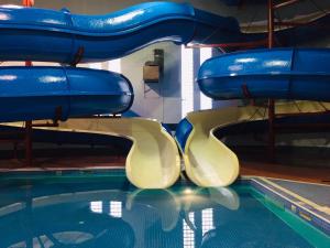 a water slide in a swimming pool at Travelodge by Wyndham Lloydminster in Lloydminster