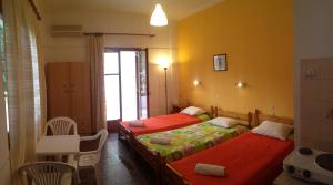 Tempat tidur dalam kamar di Ionian Breeze Apartments