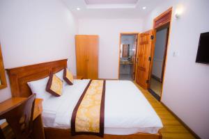 Katil atau katil-katil dalam bilik di Hồng Tùng Hotel