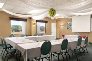 a conference room with white tables and chairs at Days Inn by Wyndham Ste. Helene-de-Bagot in Sainte-Hélène-de-Bagot