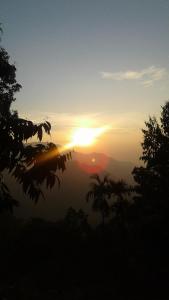 The sunrise or sunset as seen from a panziókat or nearby