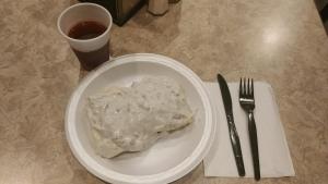 a plate of food on a table with a fork and knife at Cobblestone Inn & Suites - Denison | Majestic Hills in Denison