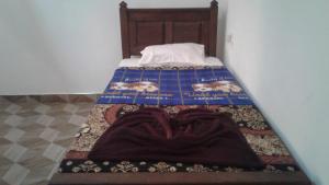 A bed or beds in a room at Sun View Resort Kithalella