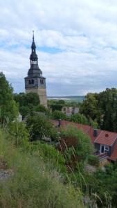 a tall building with a steeple on top of a town at Ferienhaus Scheper in Bad Frankenhausen