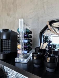 a counter top with a bunch of pots and pans at Stylový apartmán přímo u lanovky, vlastní garážové stání in Janske Lazne