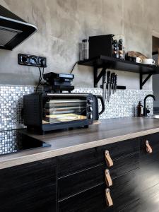 Kuchyň nebo kuchyňský kout v ubytování Stylový apartmán přímo u lanovky, vlastní garážové stání