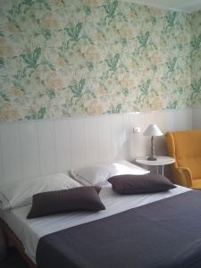 Postel nebo postele na pokoji v ubytování Hotel Malta