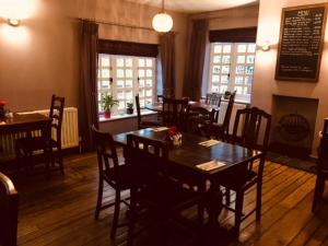 a dining room with tables and chairs in a restaurant at True Lovers Knot in Blandford Forum
