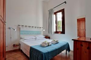 Postel nebo postele na pokoji v ubytování Il Melo Residence
