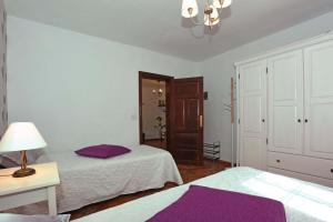 En eller flere senge i et værelse på Casa Acosta