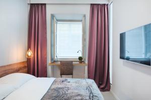 Posteľ alebo postele v izbe v ubytovaní St. Mark's Boutique Apartment Zagreb