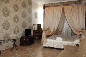 Postel nebo postele na pokoji v ubytování Voskhod Hotel