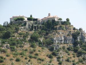 a house on top of a mountain at La cigale in Gourdon