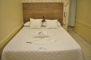 เตียงในห้องที่ Hotel Novo Sol
