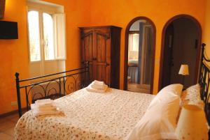 Postel nebo postele na pokoji v ubytování B&B MilleQuattrocento