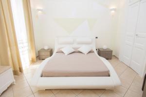 מיטה או מיטות בחדר ב-Casa Ester