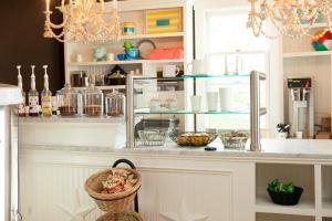 a kitchen with a counter with bowls and bottles at The Star Inn in Cape May