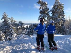 two people on skis standing in the snow at Valfjället in Gryttved