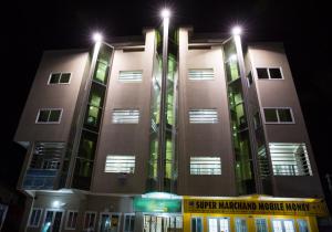 a building with lights on top of it at night at Résidence Soleil d'Afrique in Cotonou