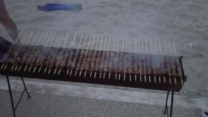 a row of hot dogs cooking on a grill at Casa Dellestate in Grottammare