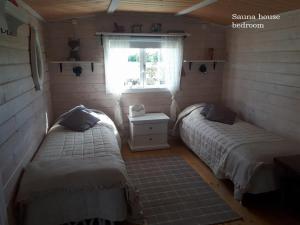 Postel nebo postele na pokoji v ubytování Windmill - Summer house