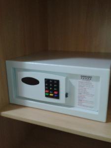 a white microwave on a shelf in a room at Hotel Americano in Rio de Janeiro