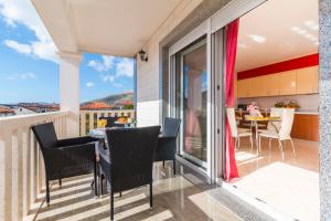 a balcony with a table and chairs and a view at Apartments Jozic in Trogir