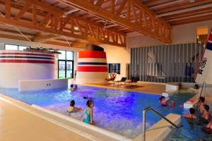 a group of people in a swimming pool at Residentie Mariposa in Knokke-Heist