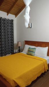Ein Bett oder Betten in einem Zimmer der Unterkunft Classique International in Dominica