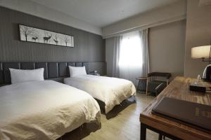 Voodi või voodid majutusasutuse Fulidun Hotel Kenting toas