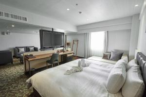 Voodi või voodid majutusasutuse Fulidun Hotel Kenting toas