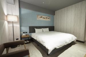 Voodi või voodid majutusasutuse Fulidun Hotel Kenting toas