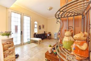 a room with a bed with a vase on a table at 夏日澄藍The Charming Land in Baisha
