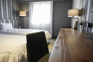 Voodi või voodid majutusasutuse Fulidun Hotel Kenting toas