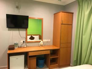 TV a/nebo společenská místnost v ubytování Kangsar Hotel + 24 fotografií