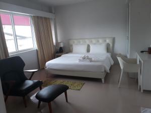 Postel nebo postele na pokoji v ubytování S2S Queen Trang Hotel
