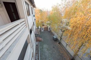 a view from the balcony of a building with trees at Garsoniere Central in Satu Mare