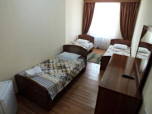 Postel nebo postele na pokoji v ubytování GYM Inn