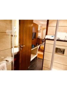 Postel nebo postele na pokoji v ubytování JRD Pride-Business Hotel