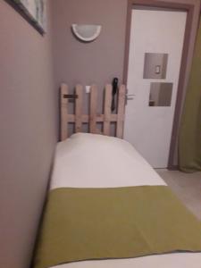 Postel nebo postele na pokoji v ubytování Hotel Le Beauregard